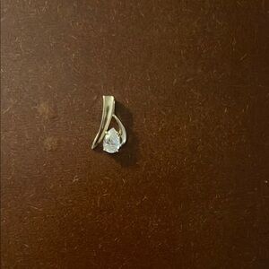 Elegant Gold and Silver Pendant with Clear Gemstone